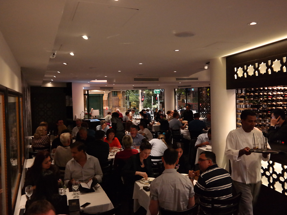 The Malabar dining room in the evening, every table taken